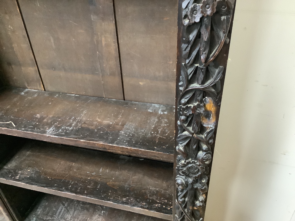 A 19th century Flemish carved oak open bookcase (adapted), length 150cm, depth 28cm, height 152cm